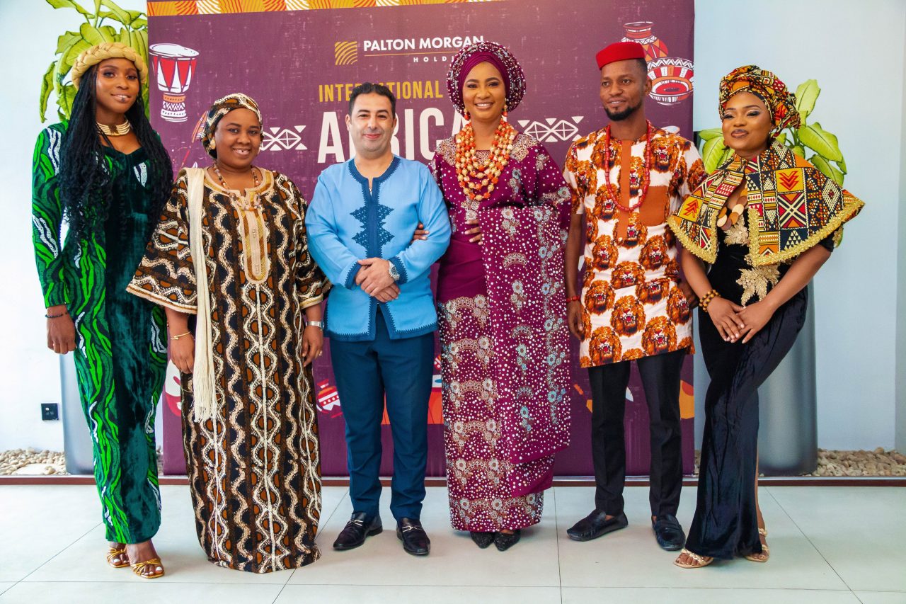 A group photo of Palton Morgan employees in African attires