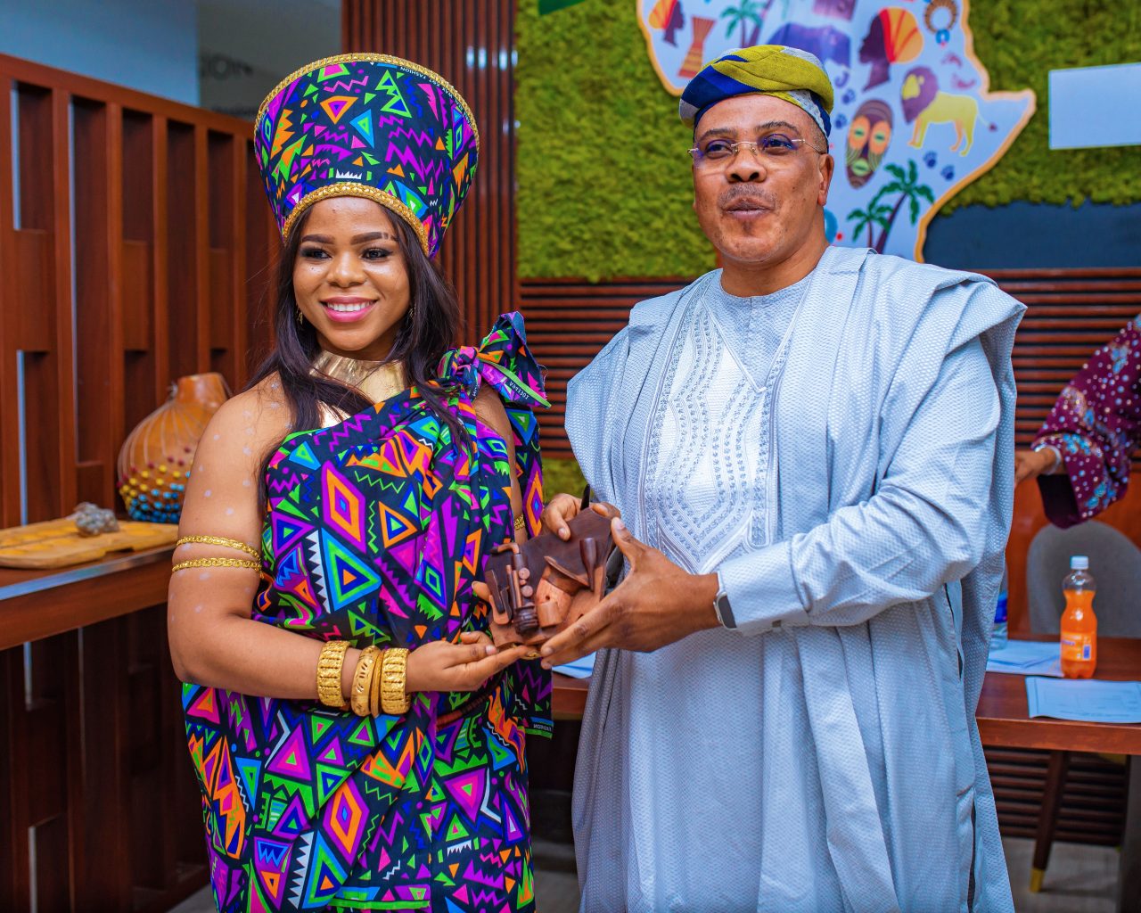African man and woman smiling at Palton Morgan's International Day of people of African Descent event
